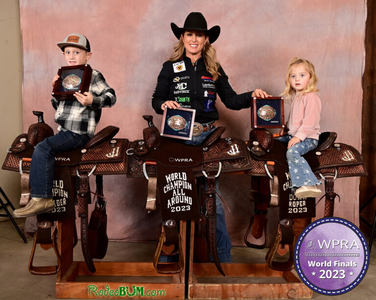 Jackie Crawford Poses with her three new World Championship Saddles.