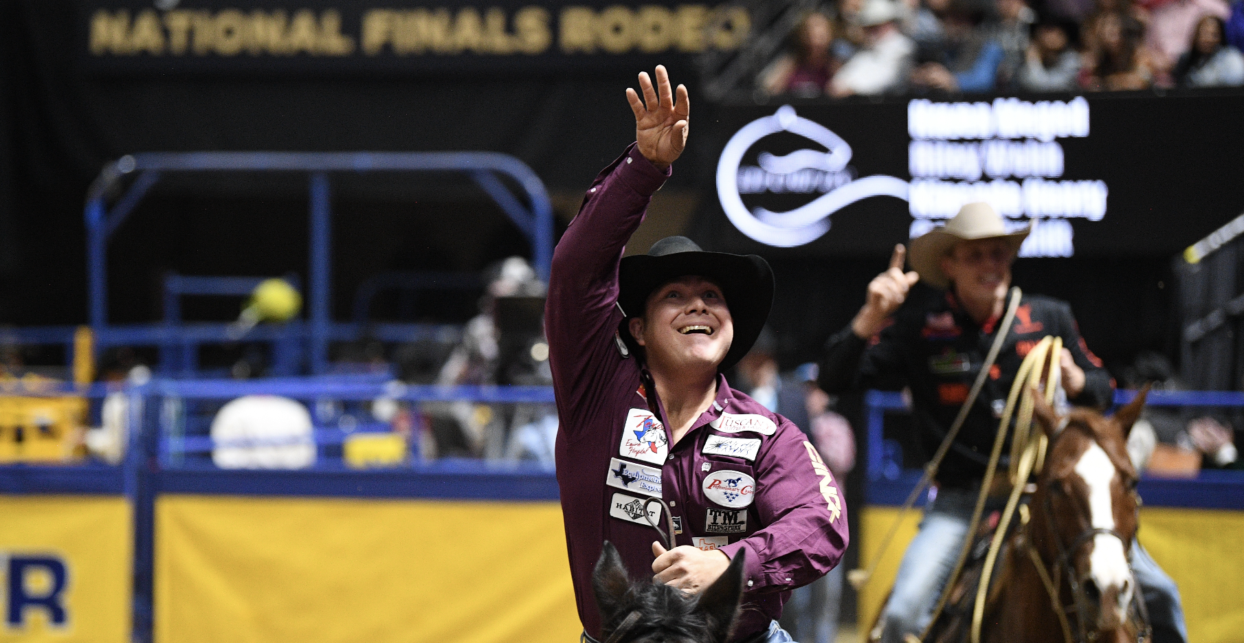 Westyn Hughes throws his piggin string into the crowd.