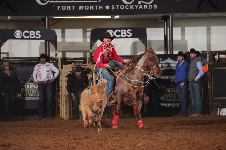 Pecos Tatum roping a calf at the WCRA Cowtown Christmas rodeo.
