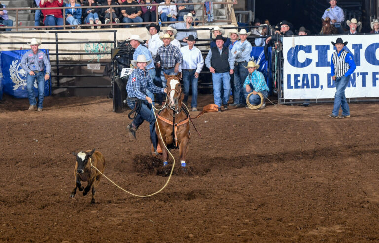 Dylan Hancock dismounting his horse to win the 2024 San Angelo Rodeo.