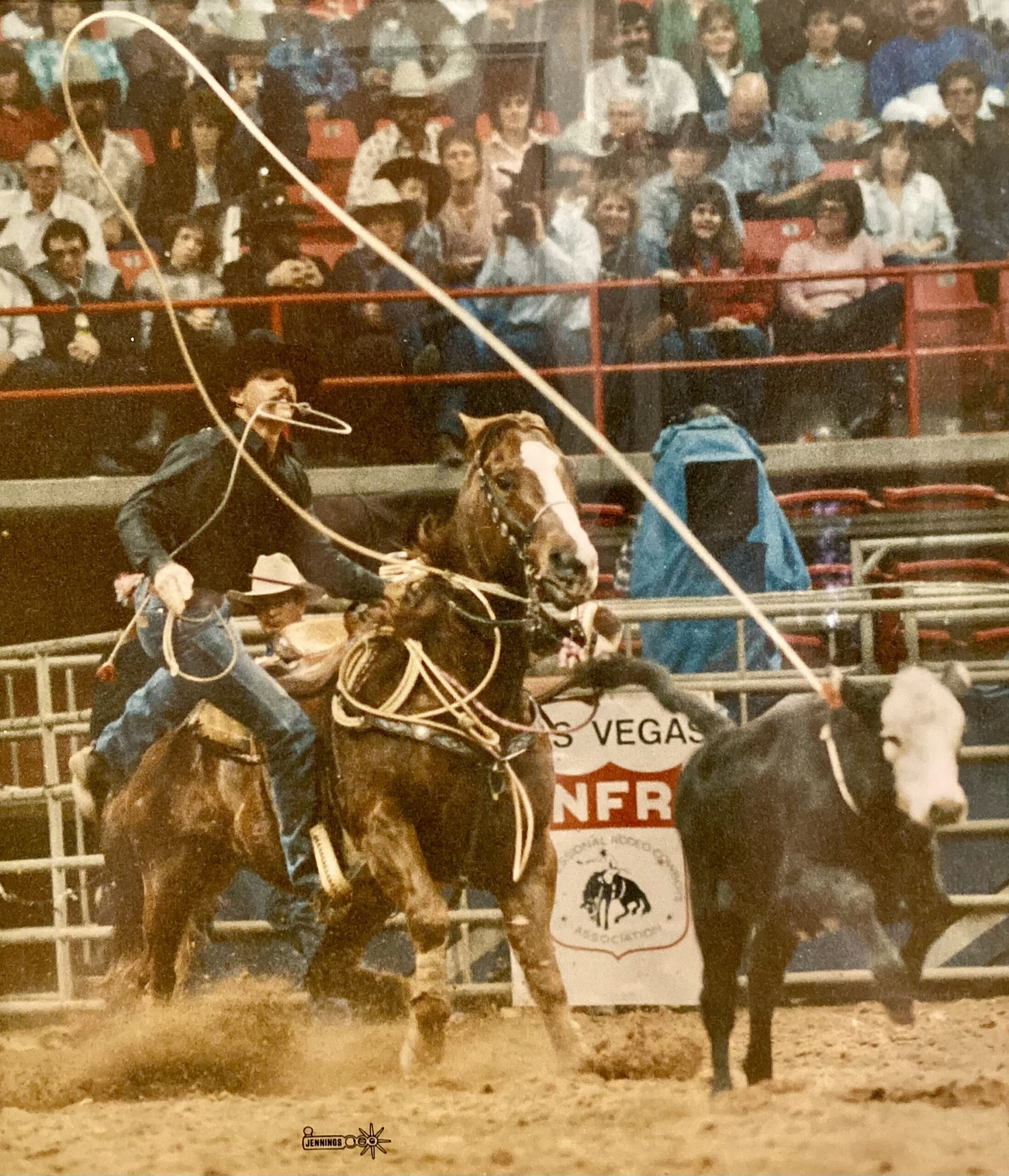 Neal Felton roping at his first NFR in 1986 on the Kyle family’s horse Crawford.