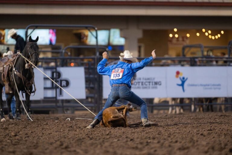 Bodie Mattson throwing his hands in the air after trying his final calf at the 2024 NFR Open.