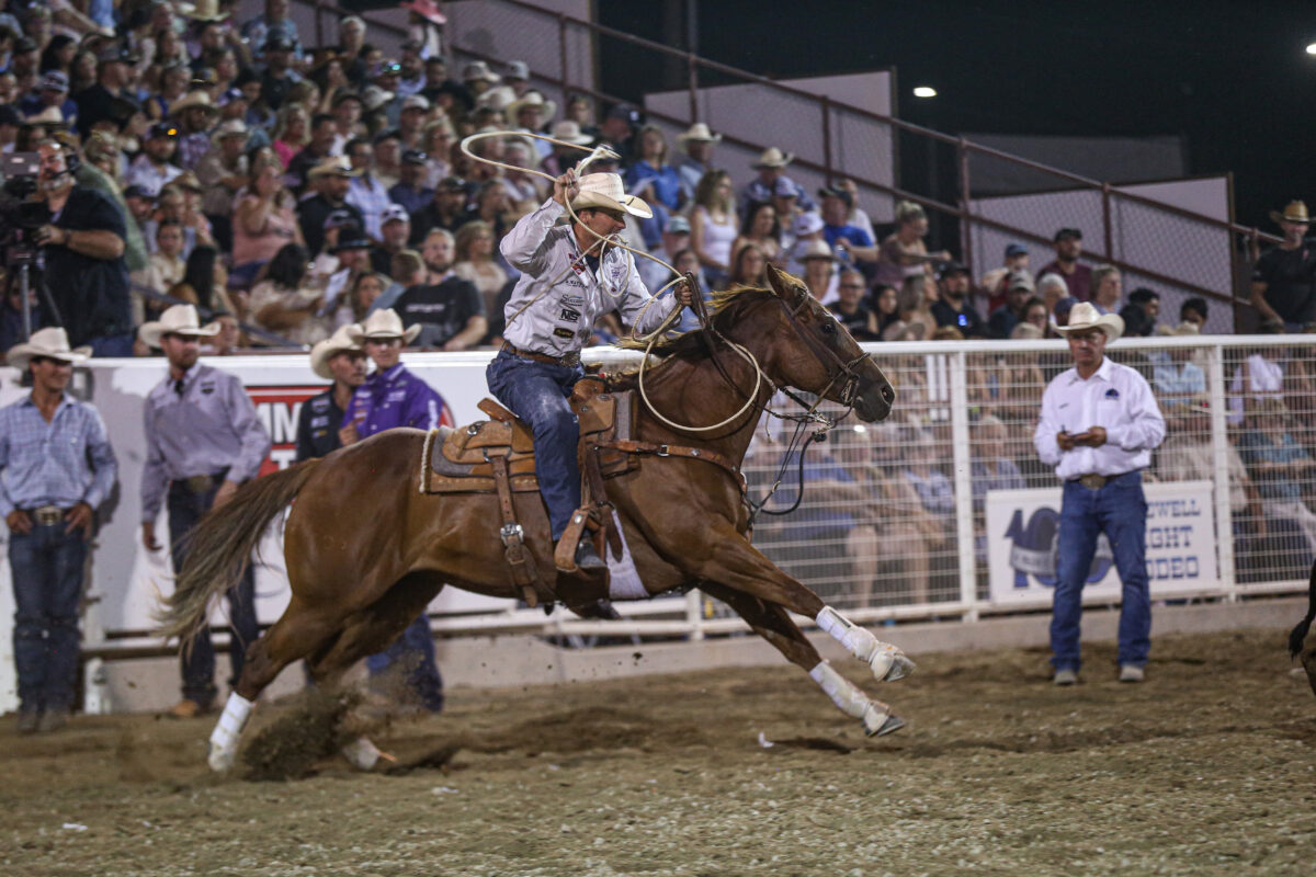 Zack Jongbloed dismounts on his way to post a time that wins the 2024 Caldwell Night Rodeo.